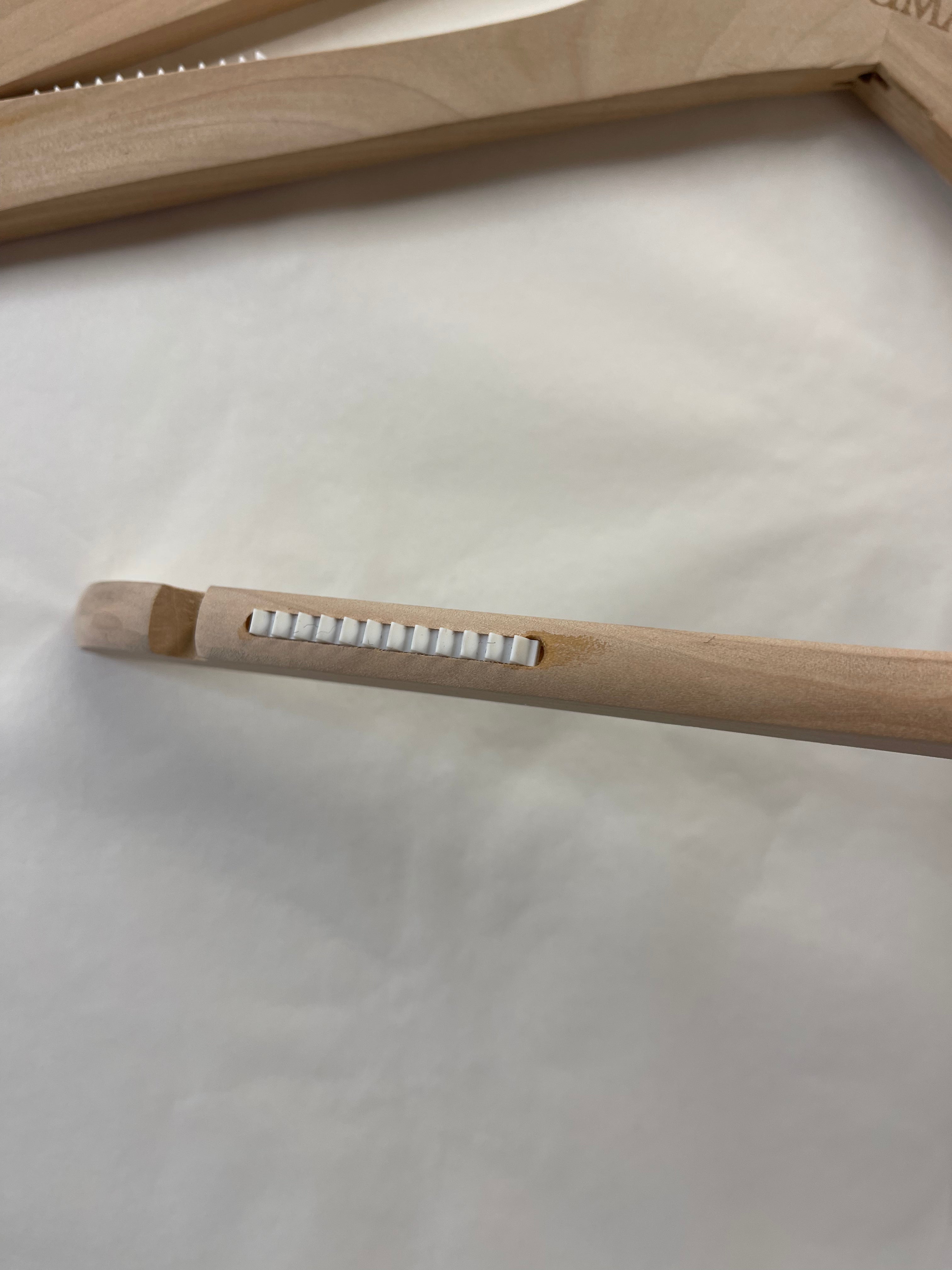 GIUMA branded wooden hanger