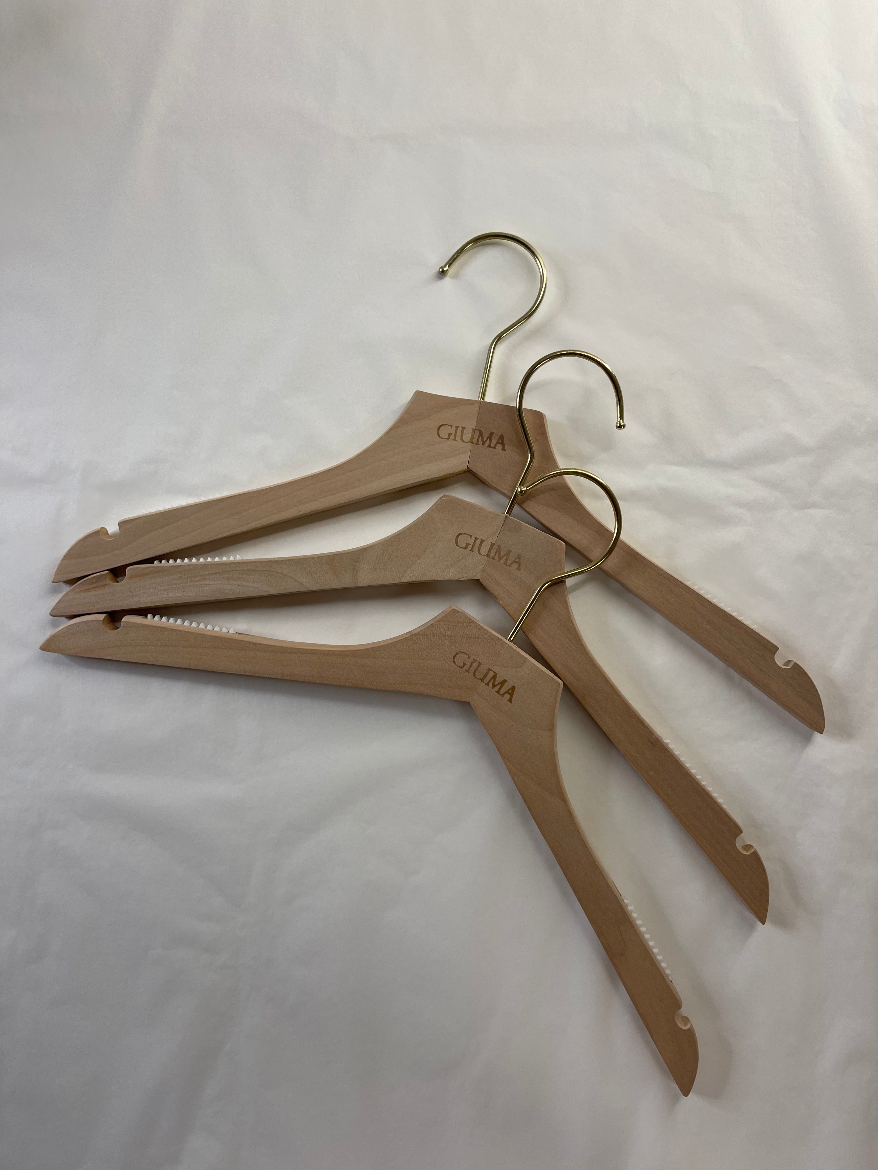 Wooden hanger with GIUMA logo