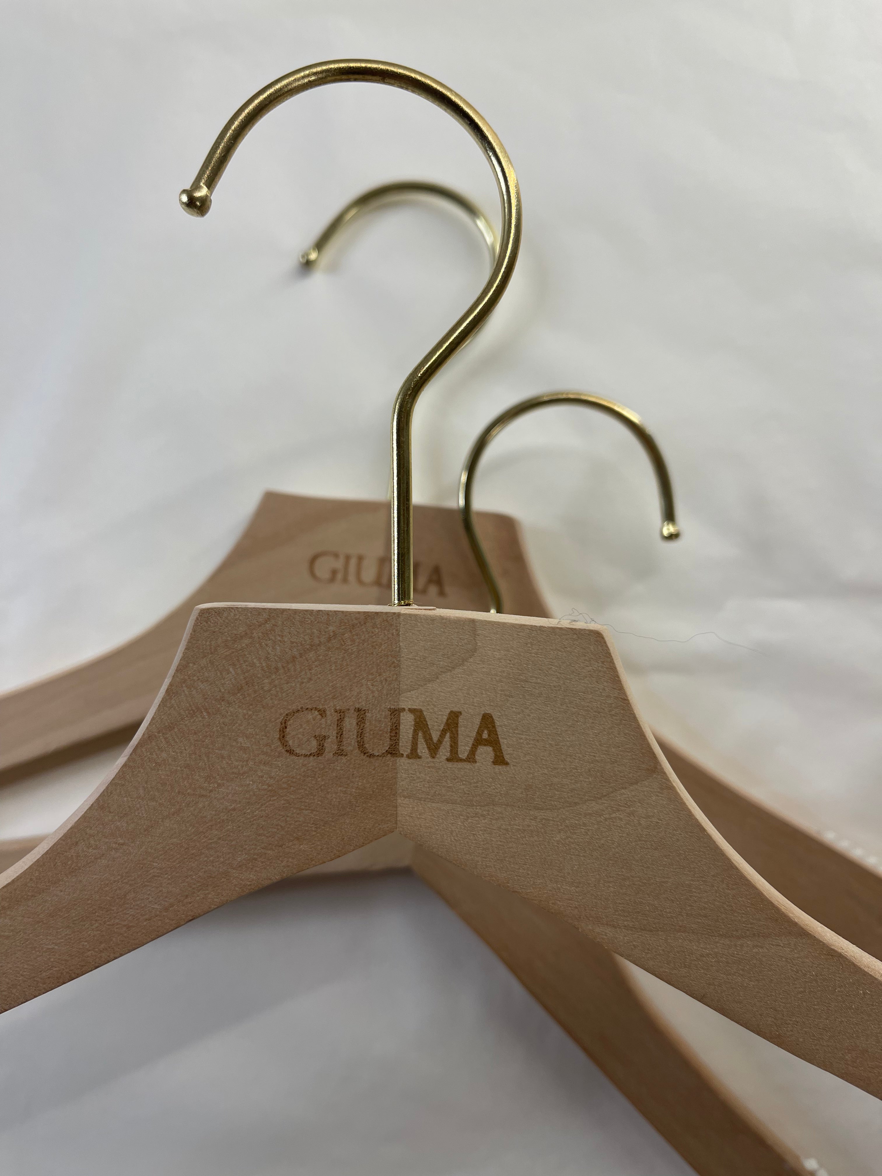 Wooden hanger with GIUMA logo